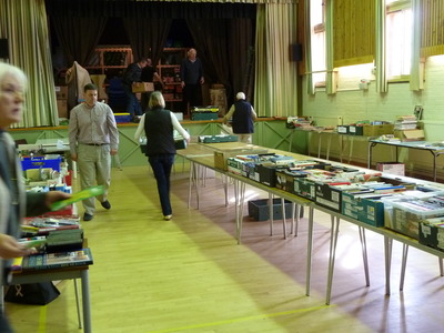 It's quite a task carrying the boxes of books to the stage. Luckily there are many helpers.